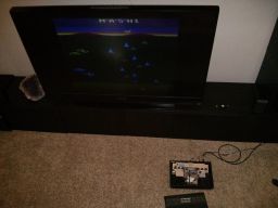 The open, modded, Atari.  Hooked up and working.